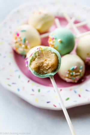vanilla cake pop with a bite taken out showing the center
