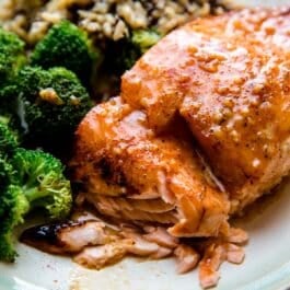honey chipotle salmon on a plate with broccoli and rice