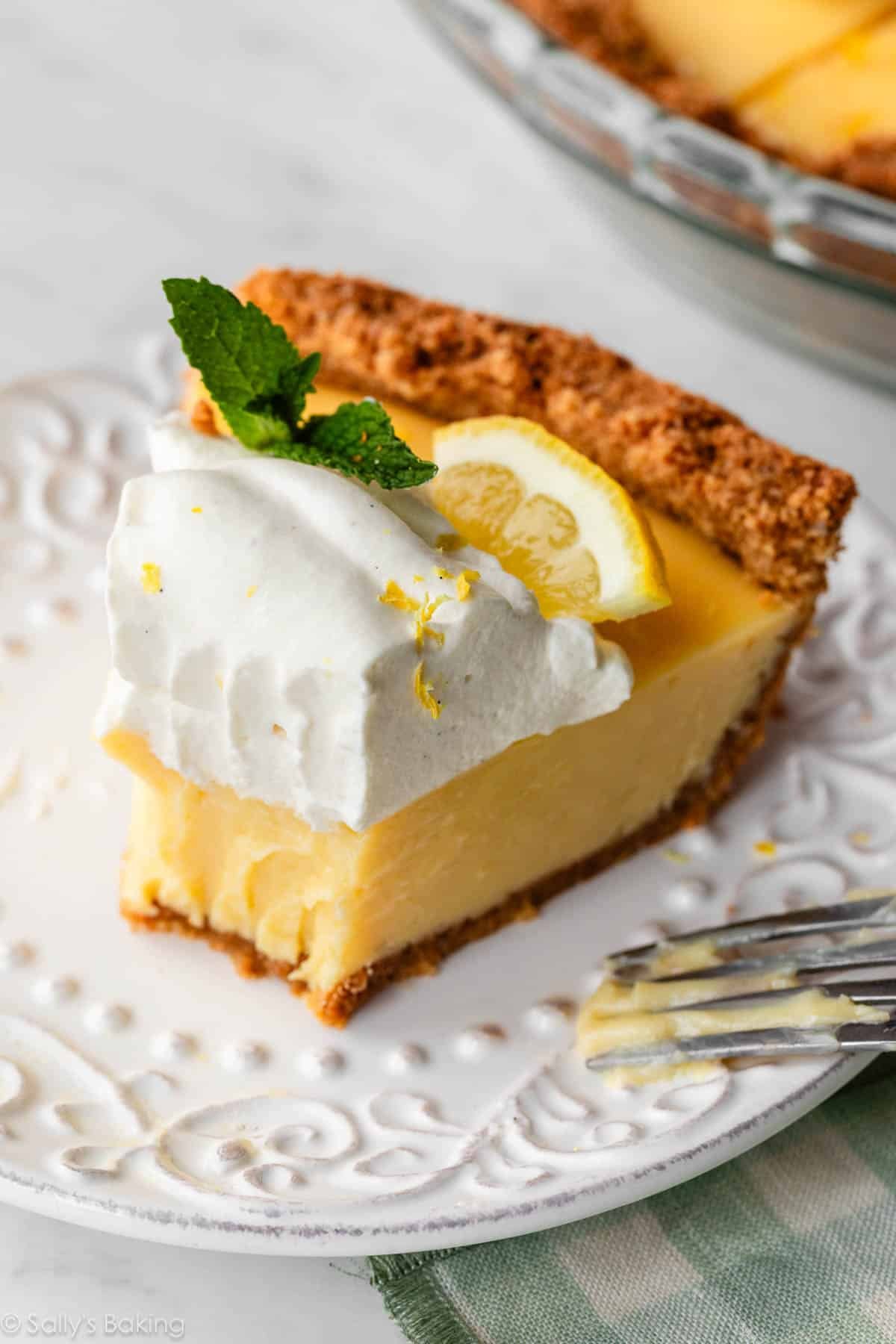 lemon pie slice on white plate.