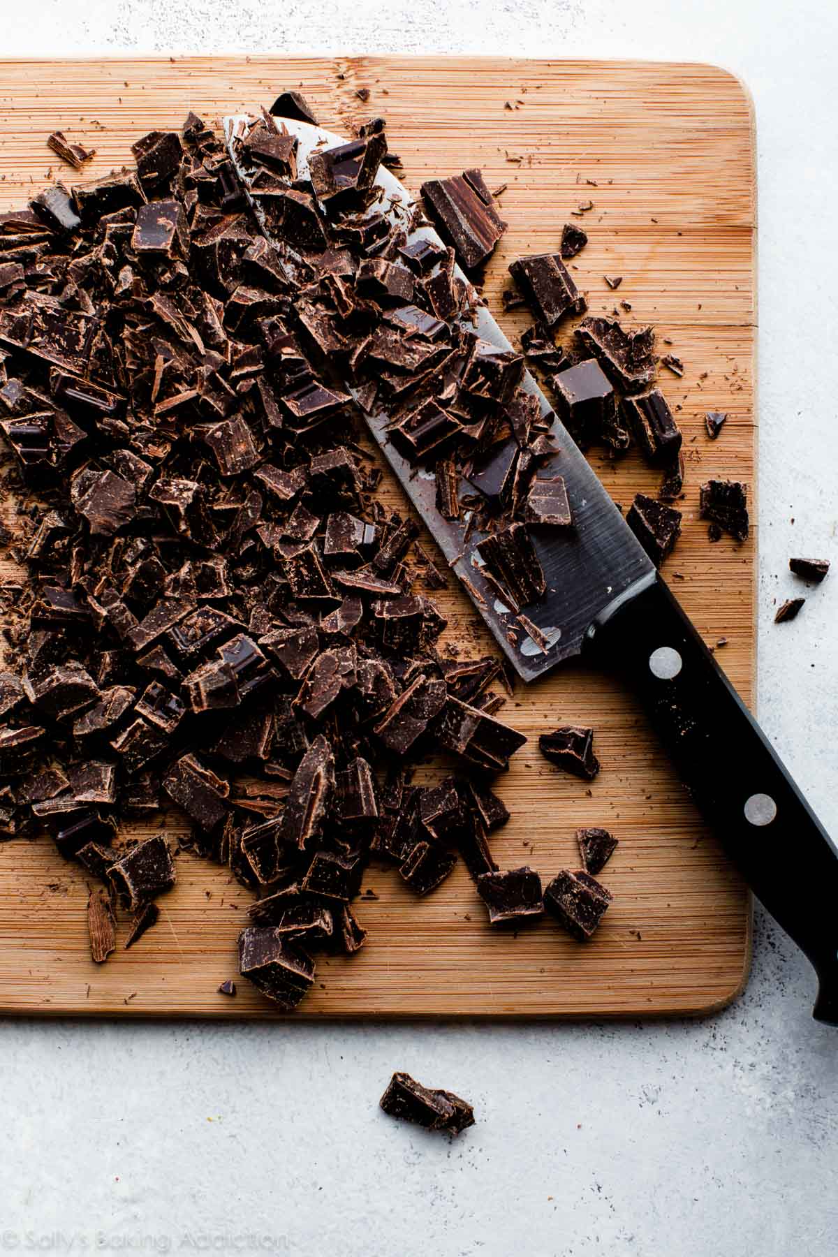 chopped chocolate on a wood cutting board