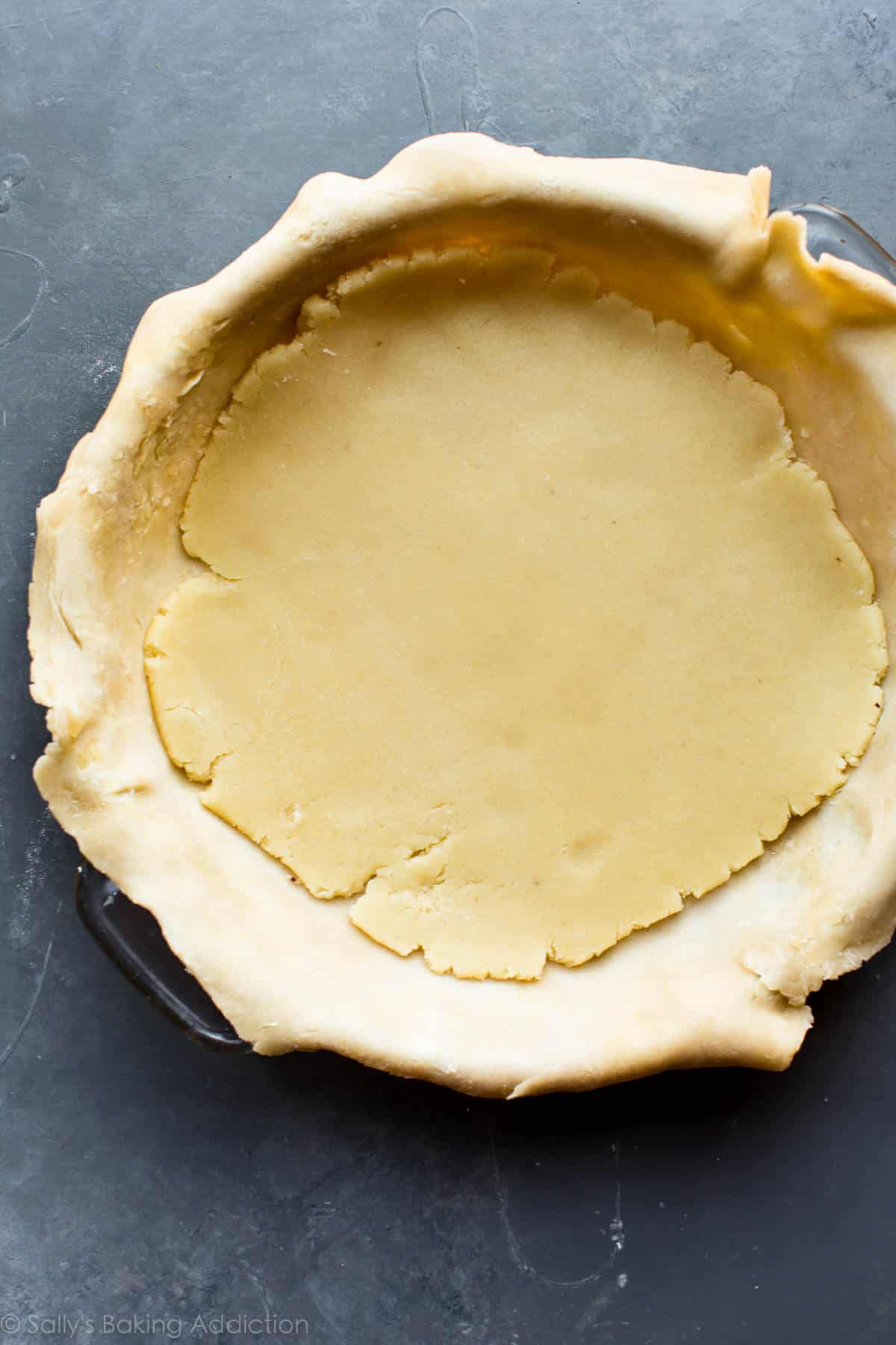 almond paste flattened on top of pie crust