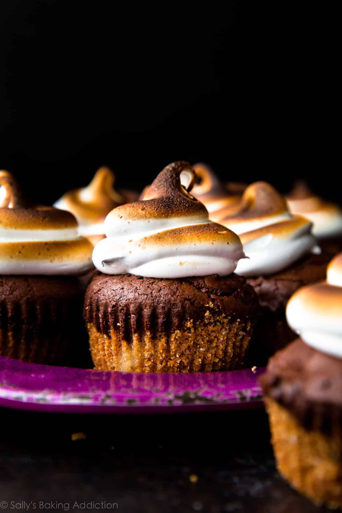s'mores brownie cupcakes on a purple plate