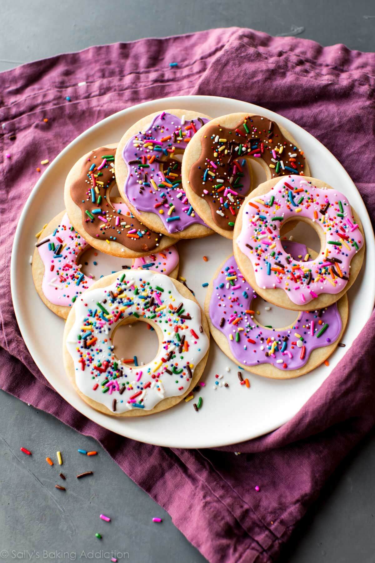 sugar cookies shaped and decorated like donuts
