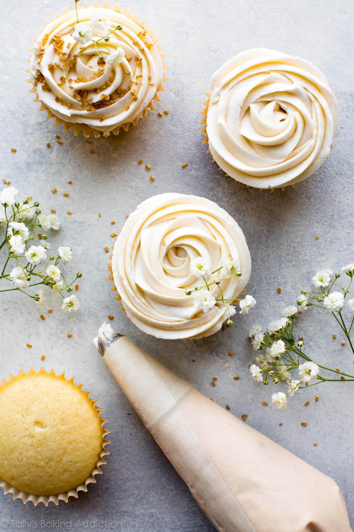 wedding cupcakes topped with champagne frosting