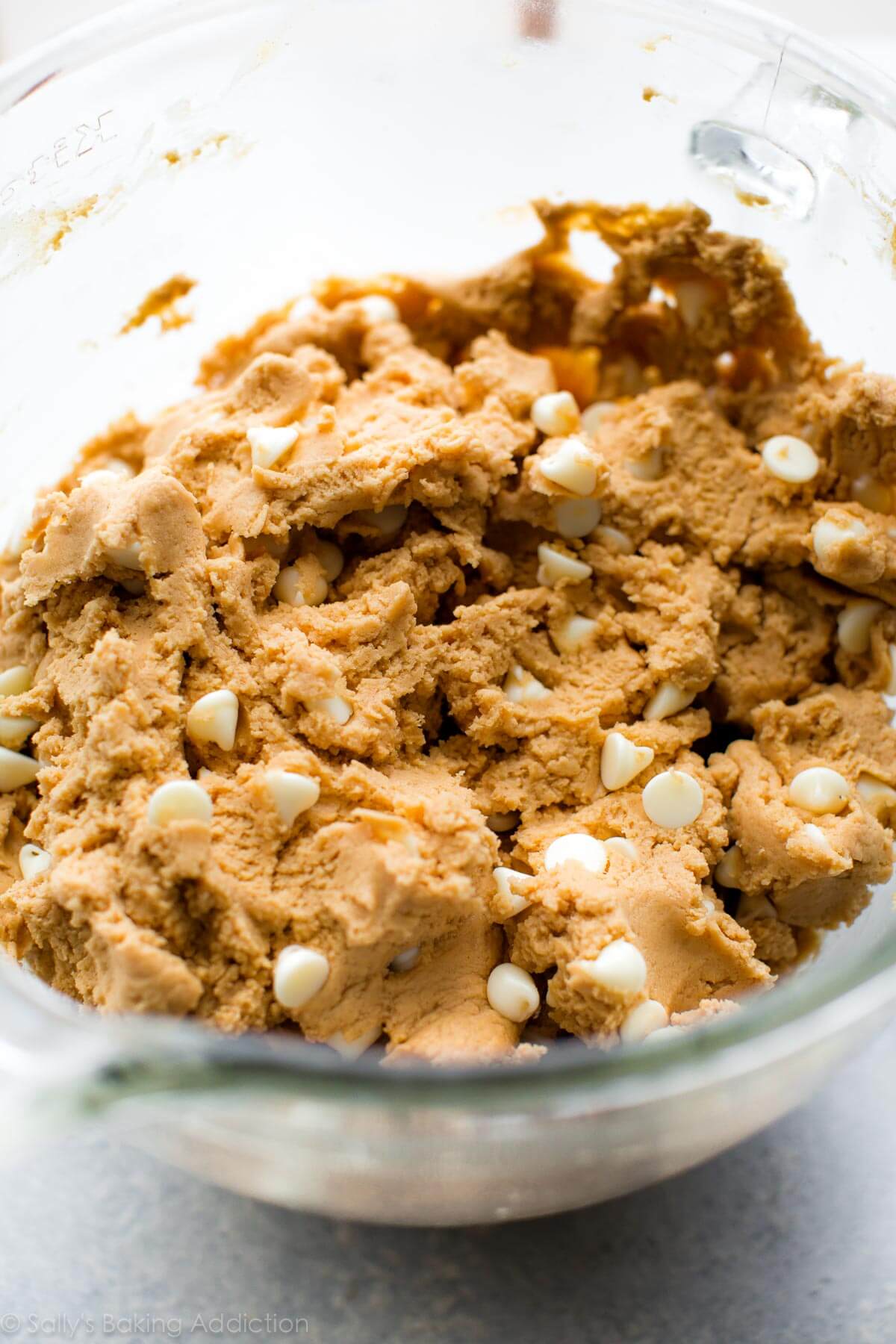 white chocolate peanut butter cookie dough in a glass bowl