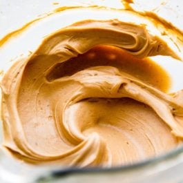 peanut butter frosting in a glass bowl