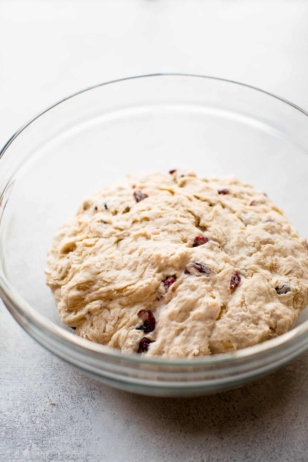 cranberry nut bread dough in a glass bowl