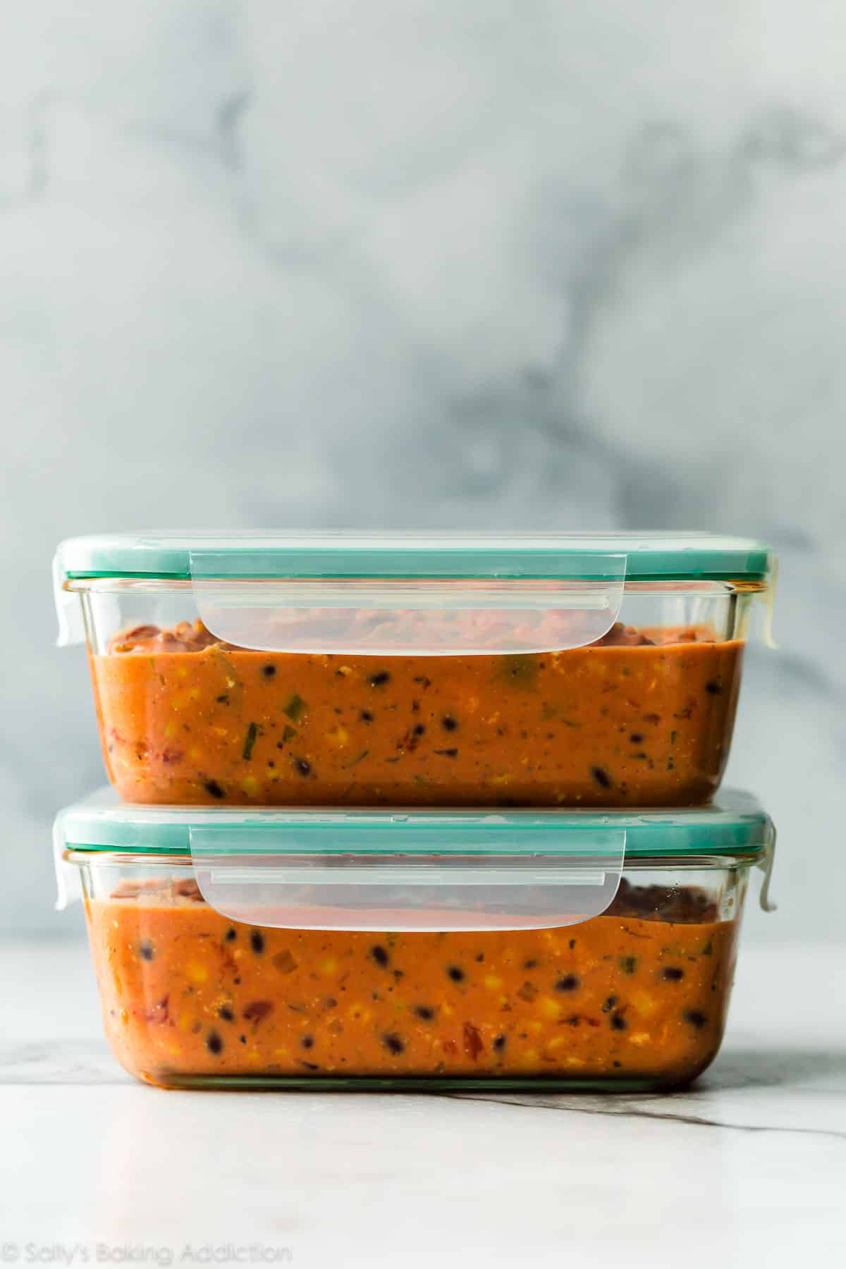 chicken chili in glass container for freezer meal