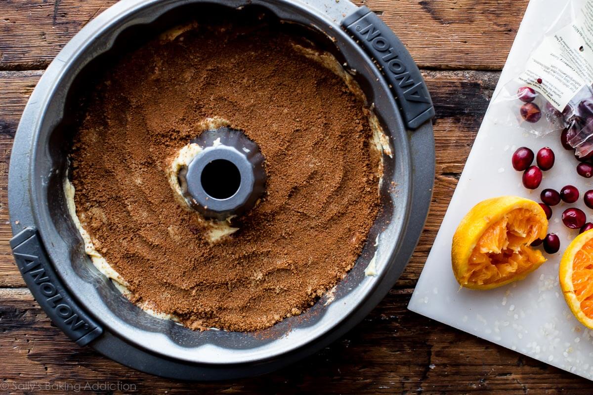 overhead image of cinnamon layer on top of cake batter in a bundt pan