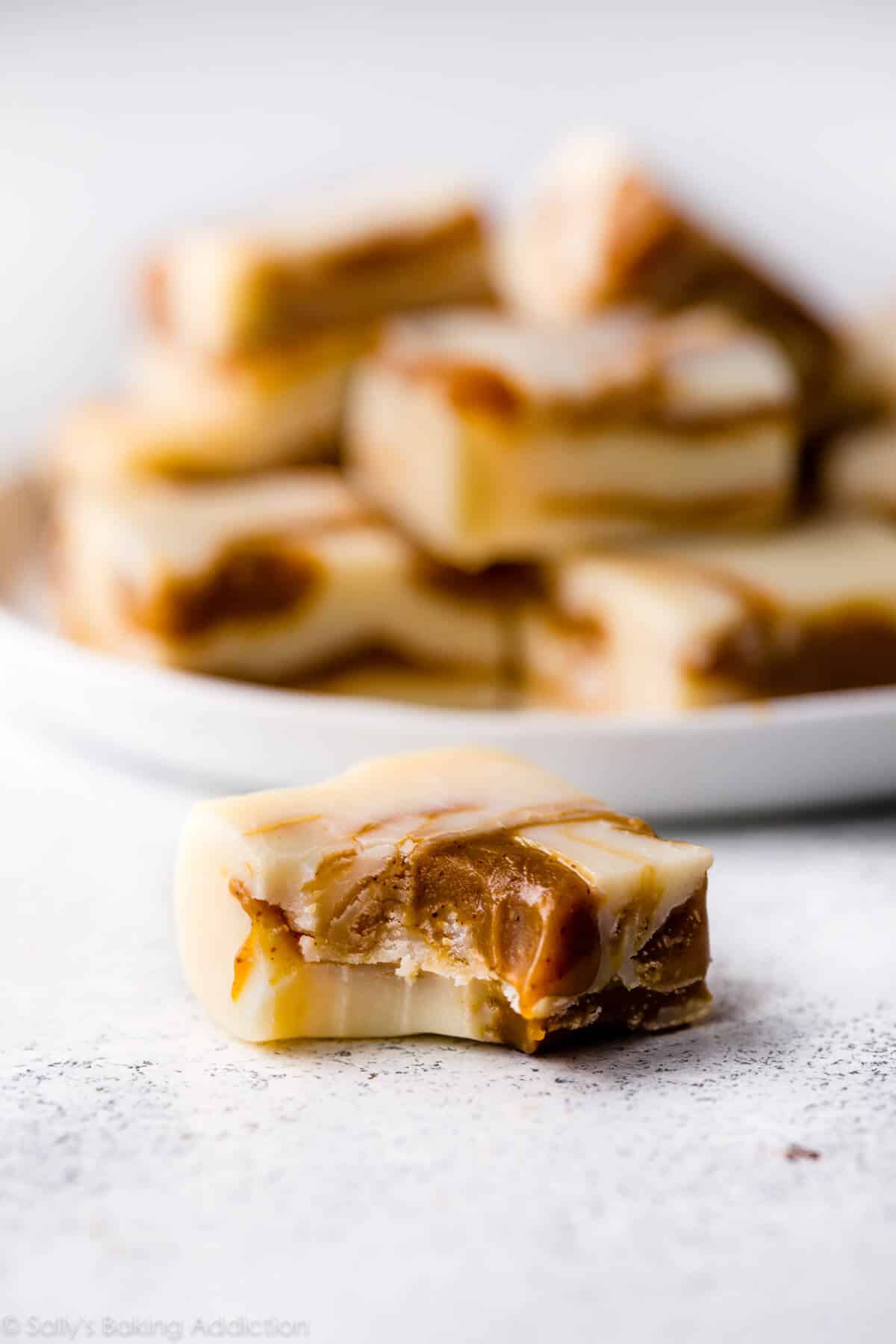 square of gingerbread swirl fudge with a bite taken