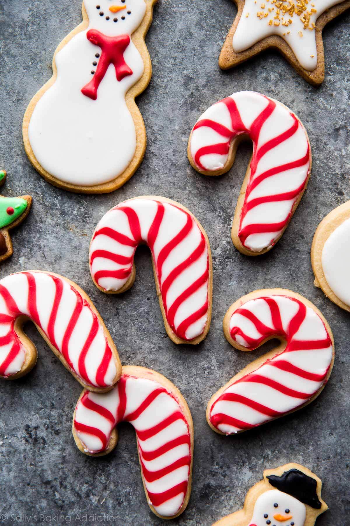 candy cane and snowman decorated sugar cookies for the holidays