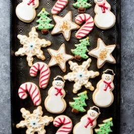 Christmas holiday decorated sugar cookies including snowmen, candy canes, Christmas trees, snowflakes, and stars