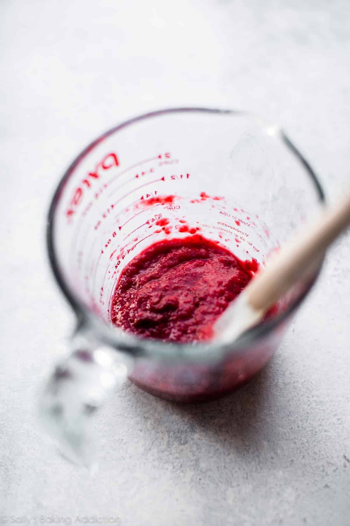 strawberry puree in a glass measuring cup