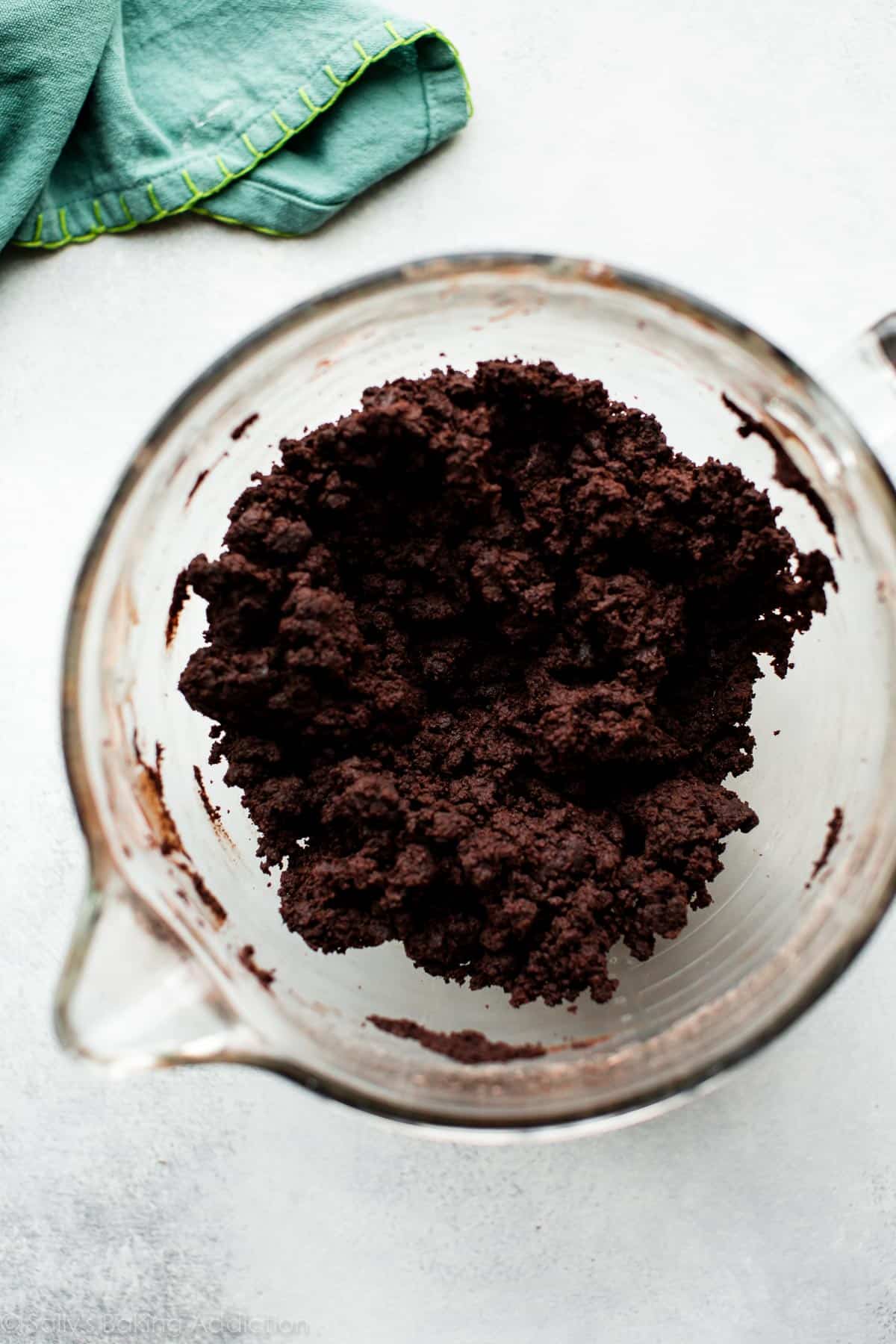 chocolate cake and chocolate frosting mixture in a glass bowl