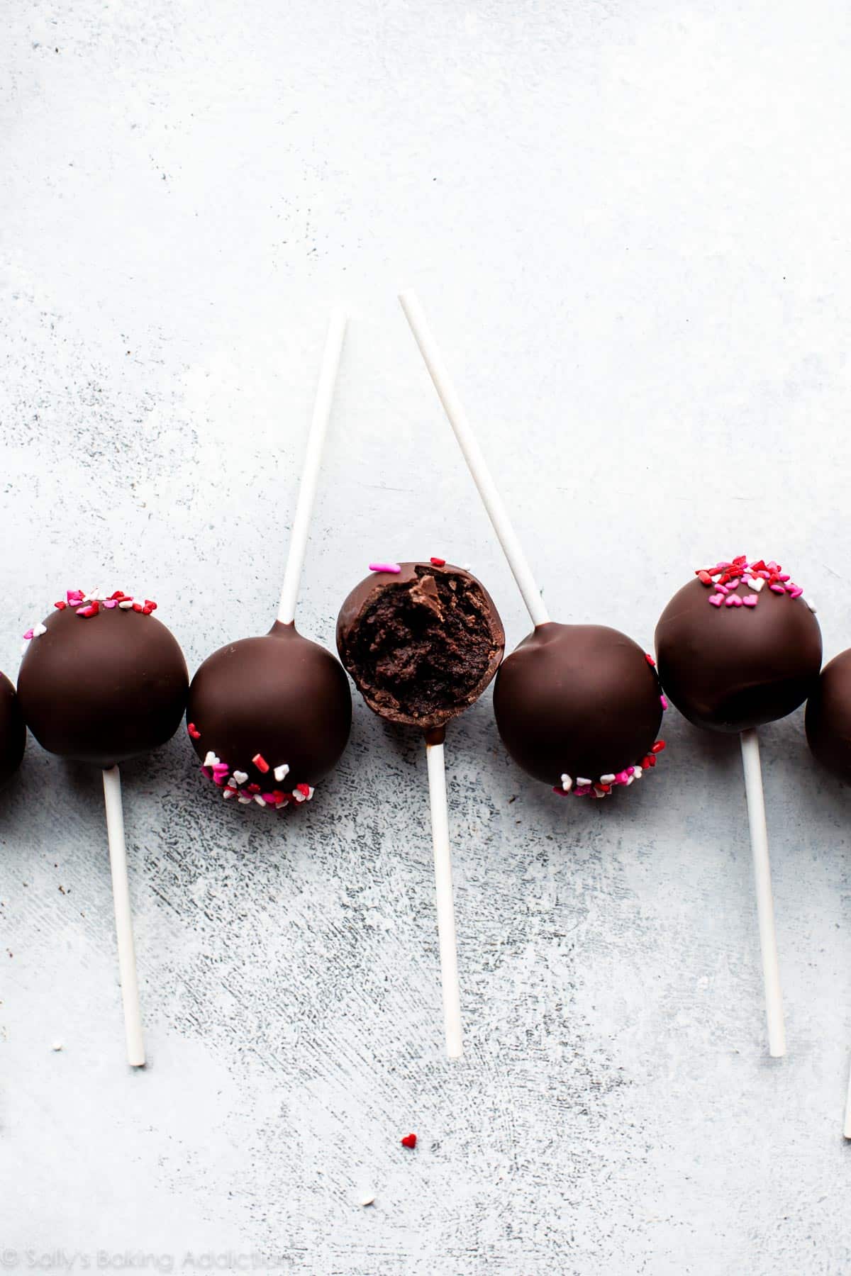 chocolate cake pops with heart sprinkles