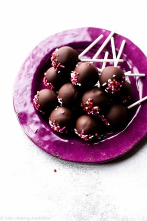 chocolate cake pops on a purple plate