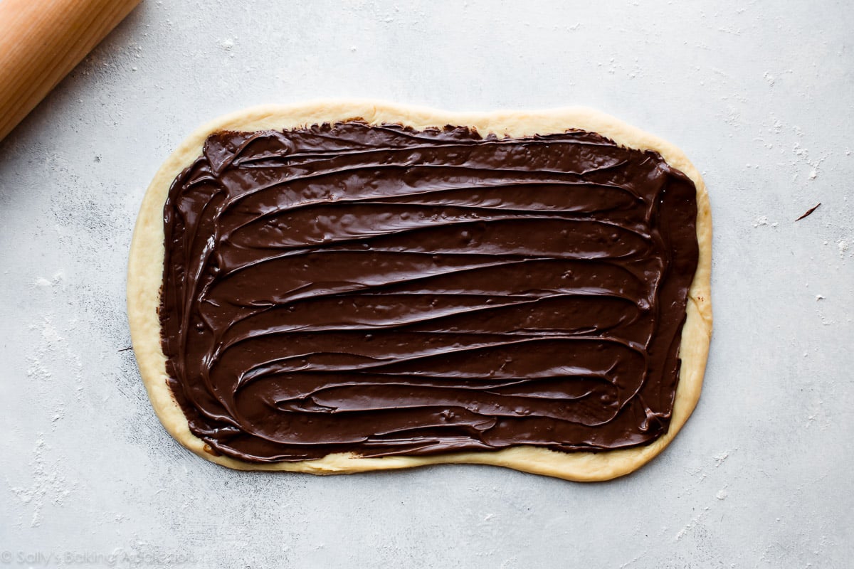 babka dough rolled out into a rectangle and topped with a layer of Nutella
