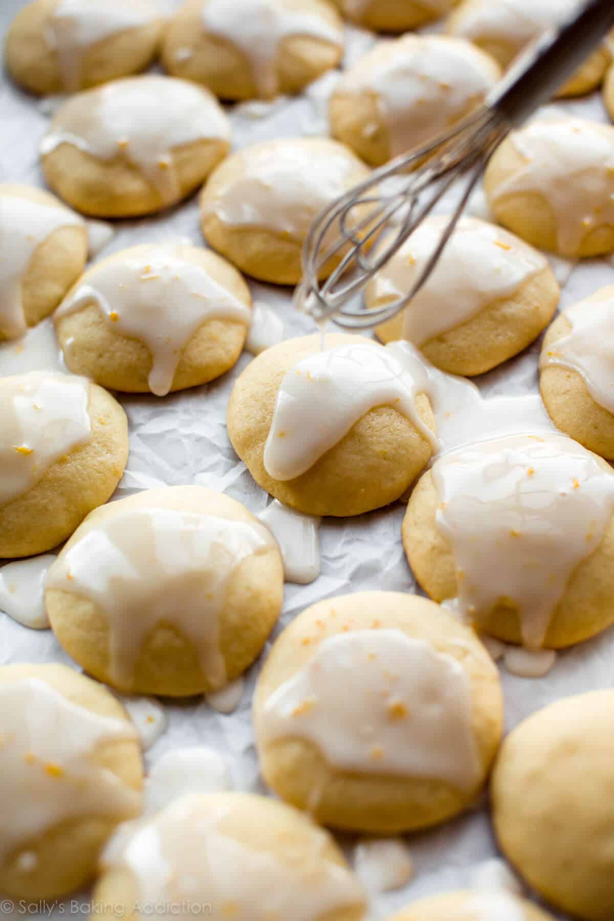 drizzling icing onto lemon ricotta cookies