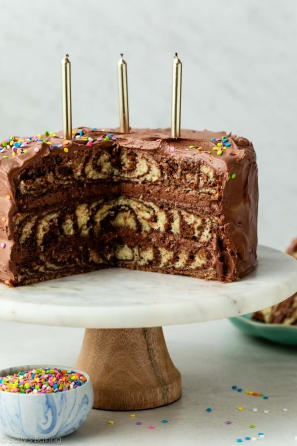 zebra layer cake with chocolate and vanilla on cake stand.