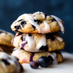 stack of blueberry muffin cookies with lemon glaze