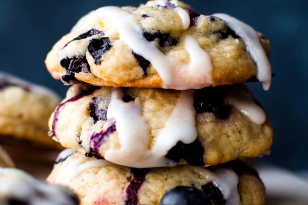 stack of blueberry muffin cookies with lemon glaze