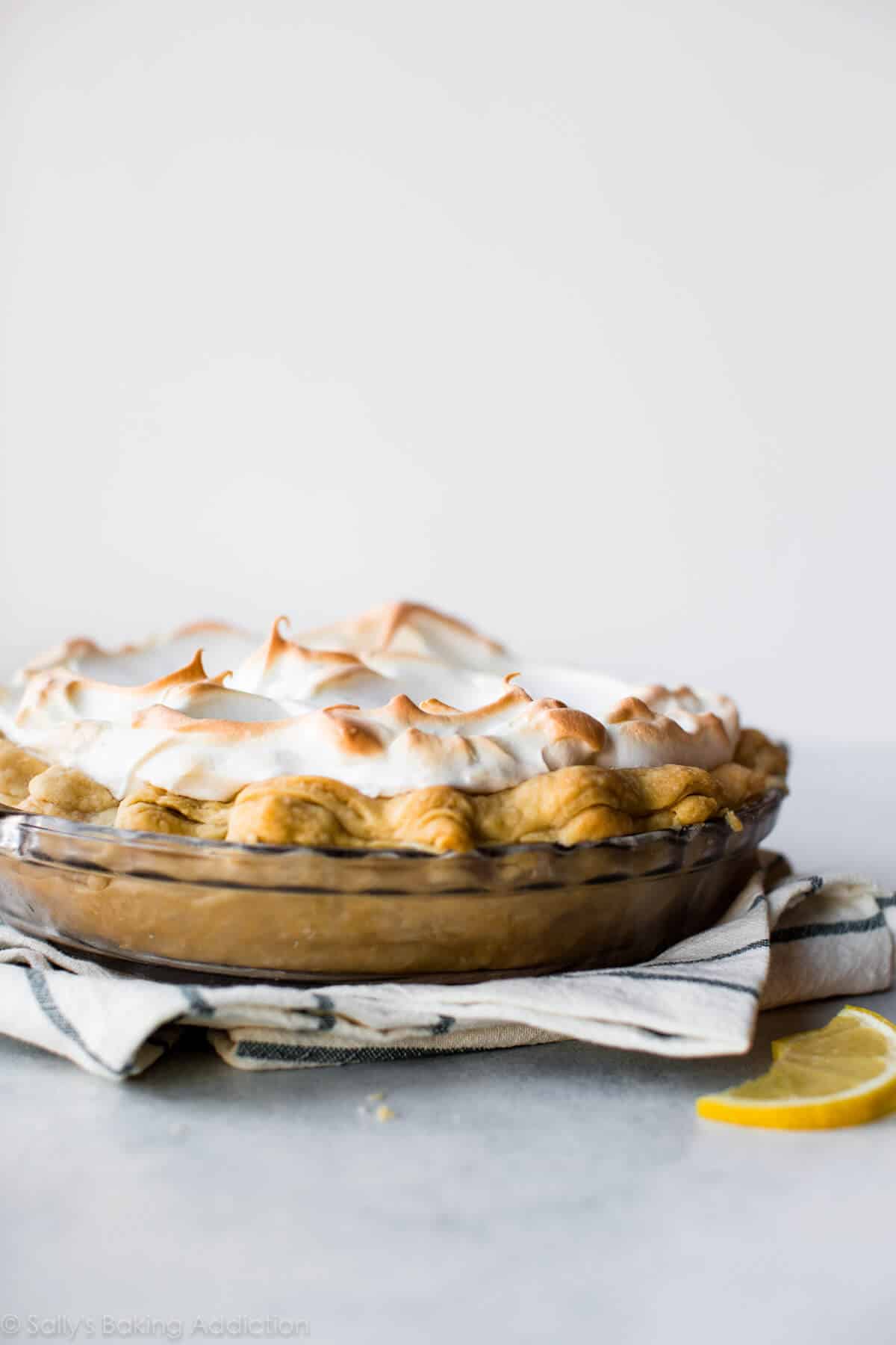 lemon meringue pie in a glass pie dish