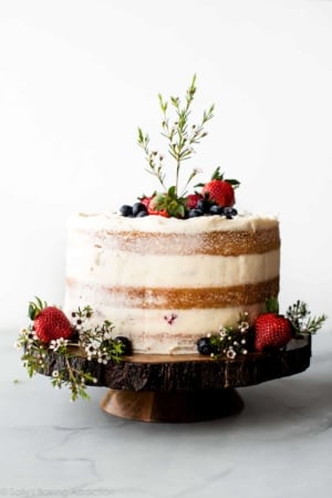 Rustic naked cake on a wood slice cake stand