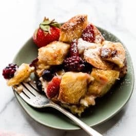 serving of mixed berry cream cheese French toast bake on green plate