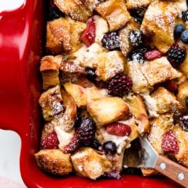 berry and cream cheese French toast casserole bake in red dish