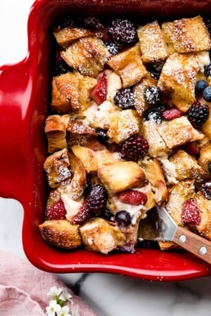 berry and cream cheese French toast casserole bake in red dish