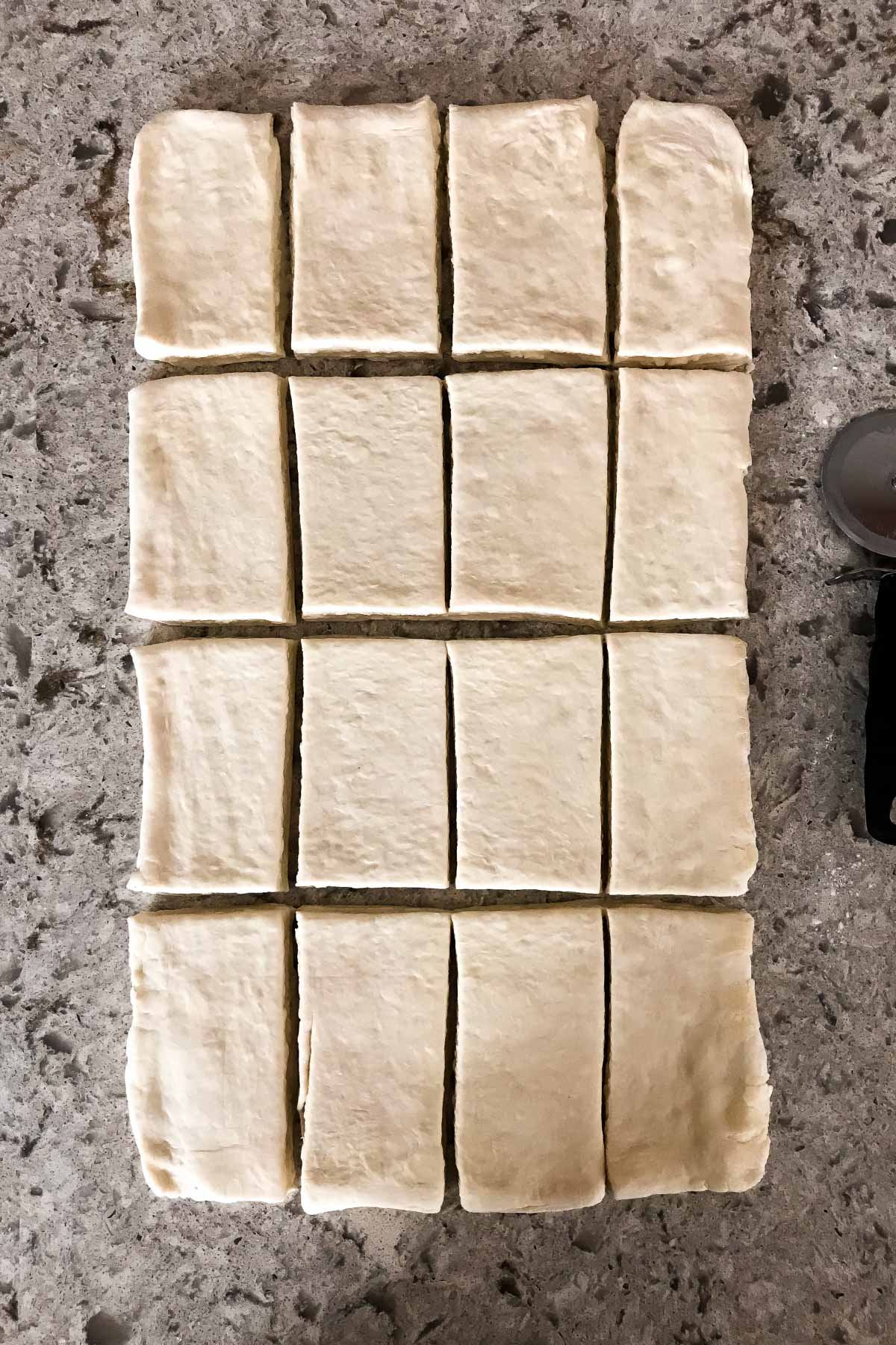 croissant pastry dough rolled out and cut into rectangles