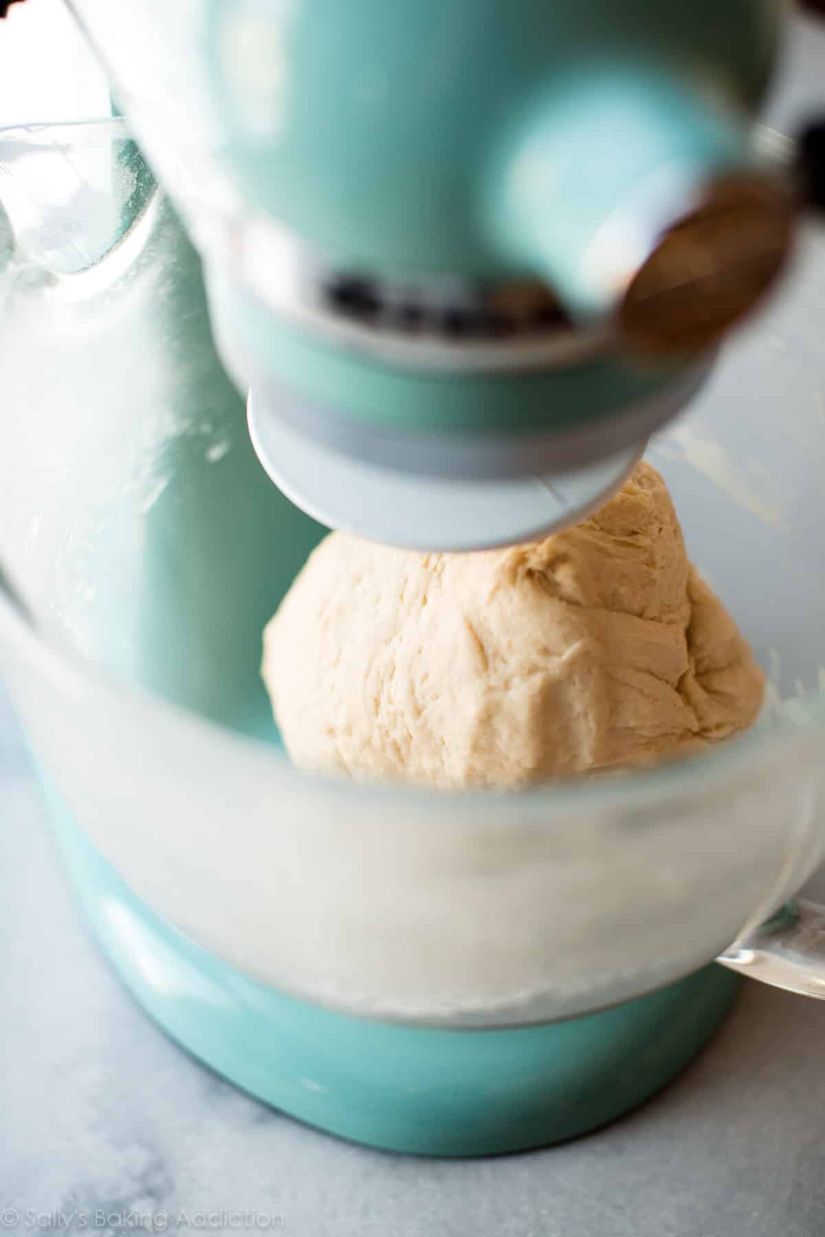 croissant dough in a stand mixer glass bowl