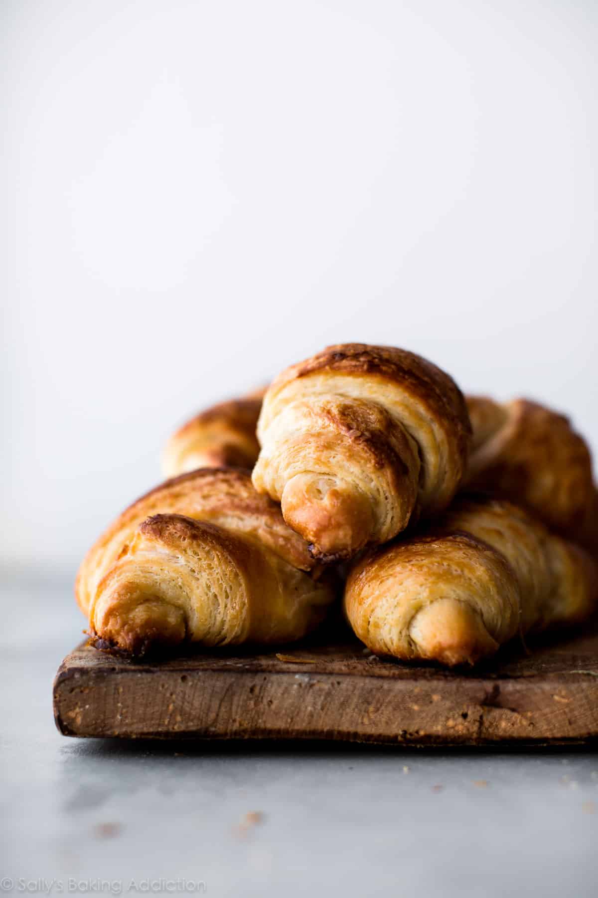 croissants on a wood serving tray