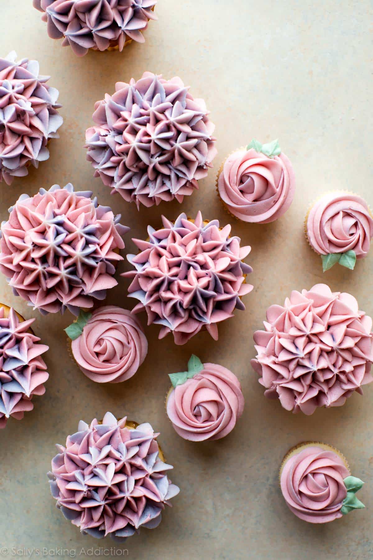 cupcakes decorated with buttercream like hydrangea and roses
