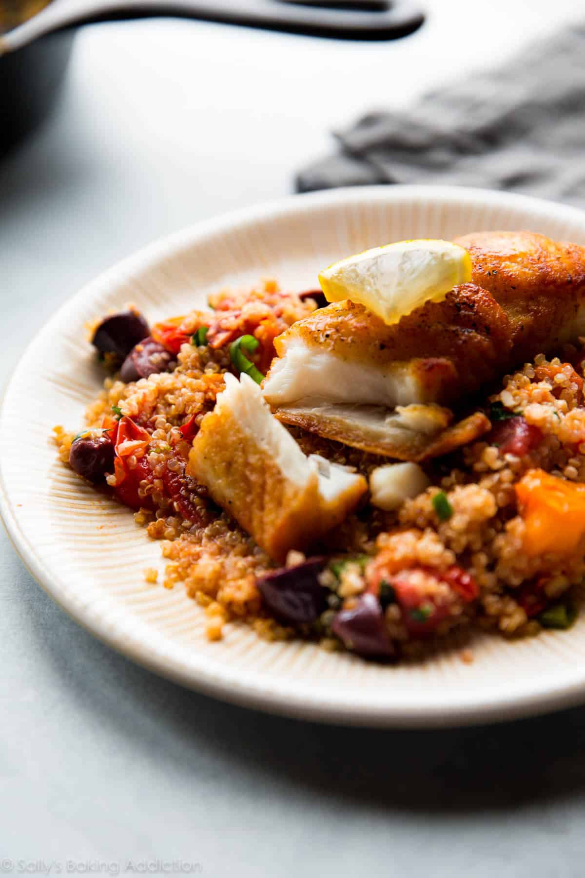 pan-seared halibut with quinoa on a plate