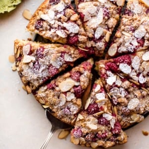 overhead image of sliced raspberry almond crumb cake