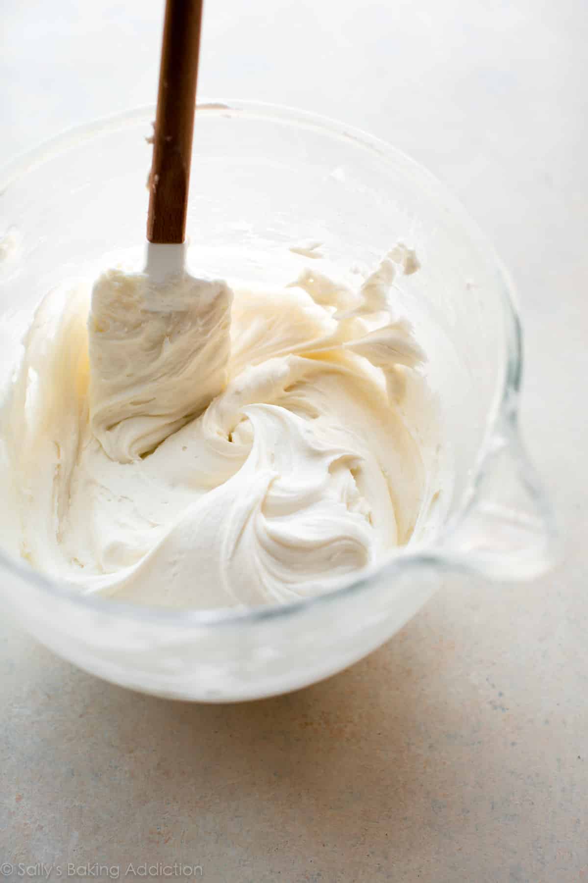 vanilla buttercream frosting in a glass bowl
