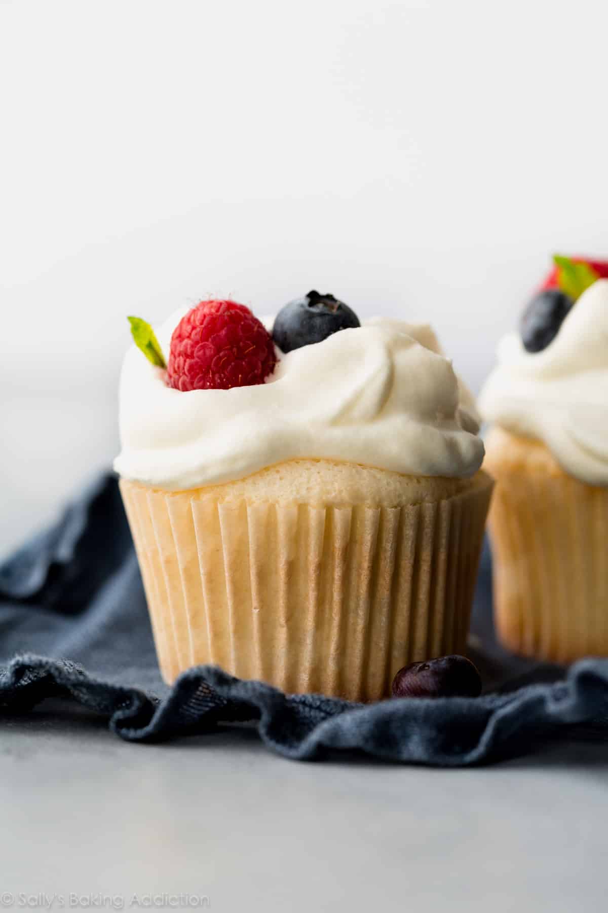angel food cupcakes topped with berries