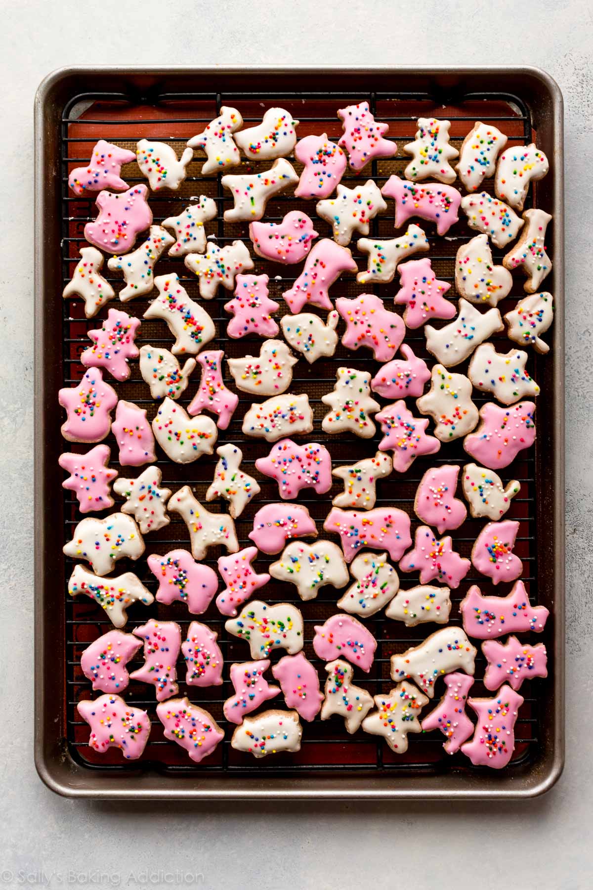 animal cracker cookies with icing on a cooling rack