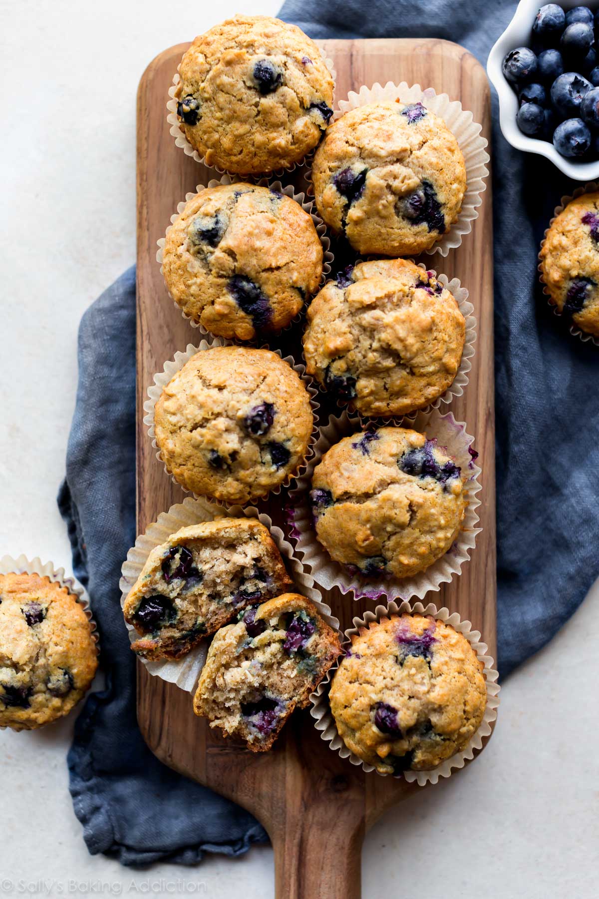 Blueberry oatmeal muffins on wood board