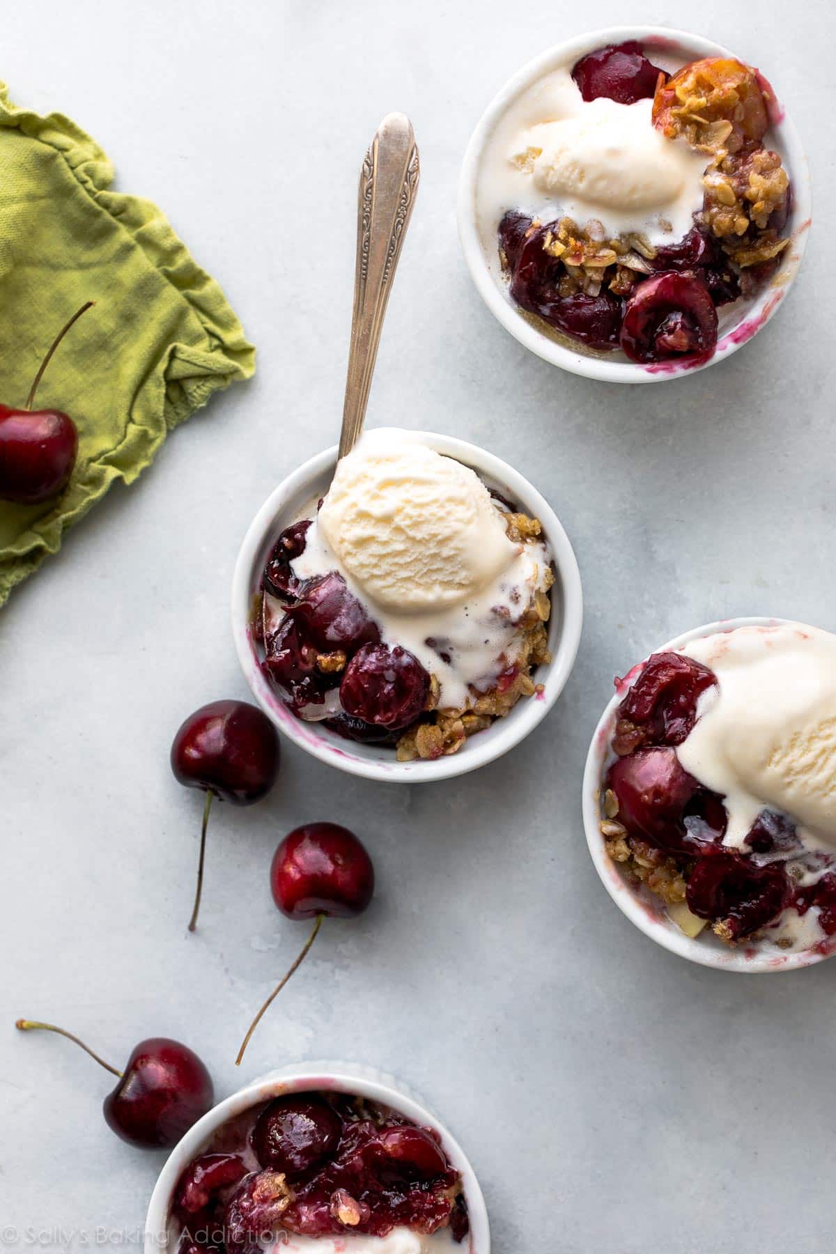 bourbon cherry crisp in individual bowls for serving