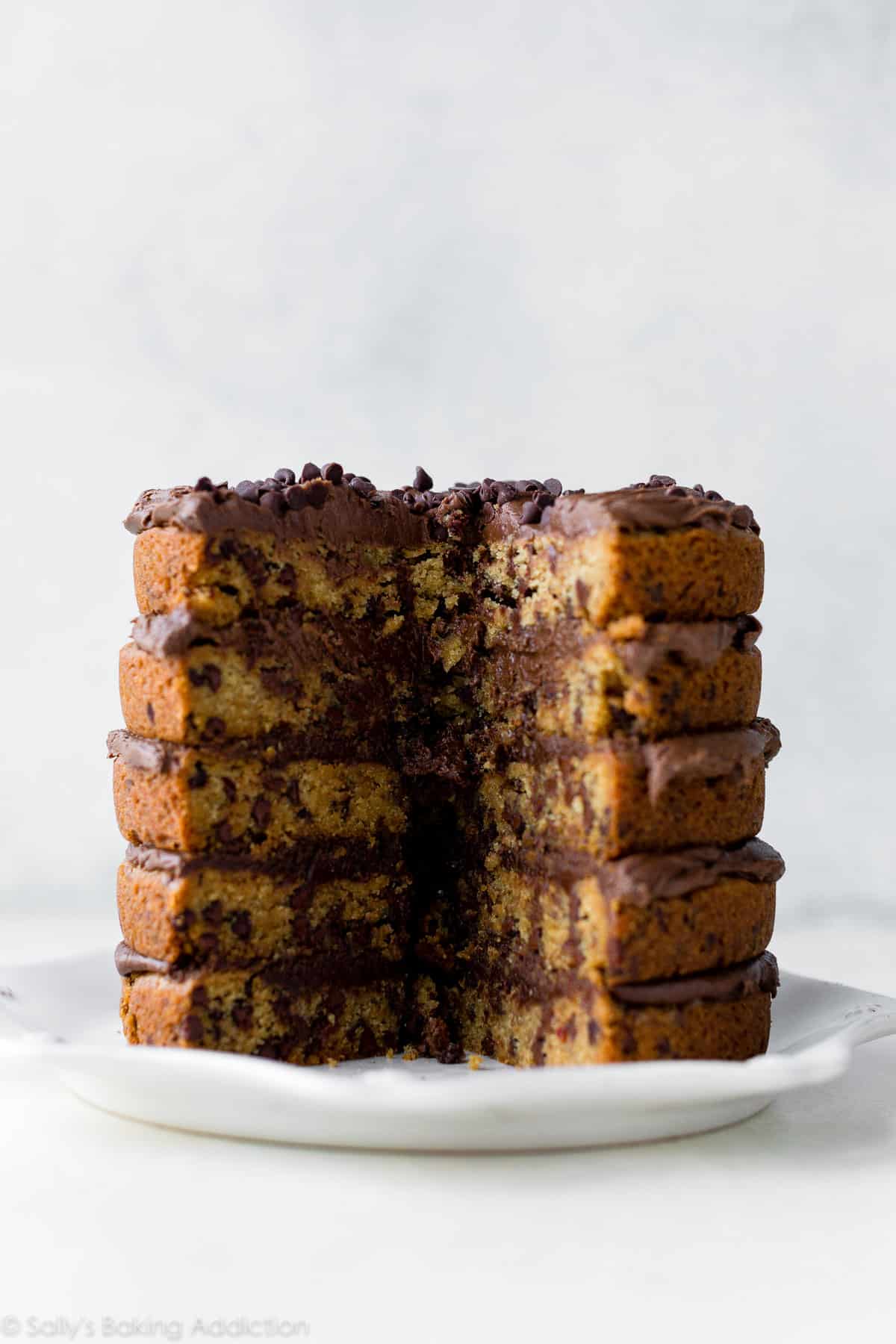 chocolate chip cookie layer cake on a white plate