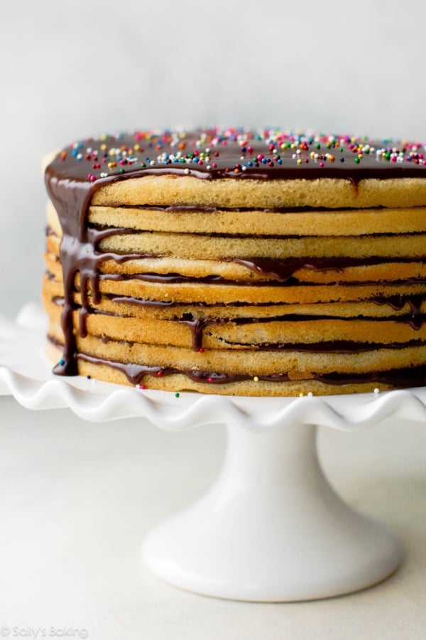 Smith Island cake on white cake stand.