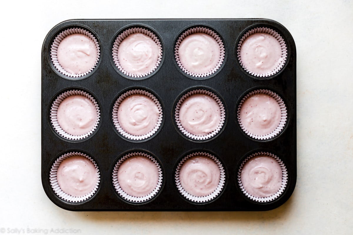strawberry cupcake batter in cupcake pan before baking