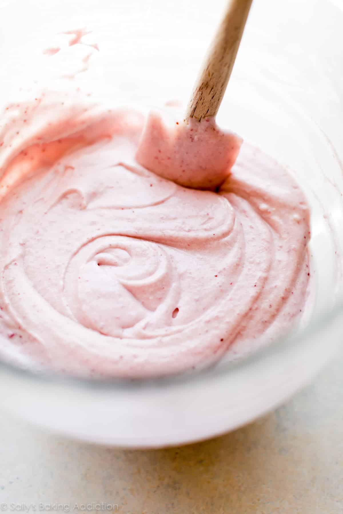 Strawberry cupcake batter in a glass bowl