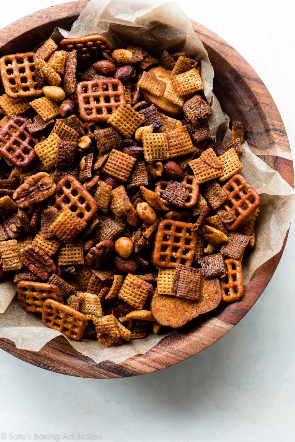 wooden bowl filled with Chex mix