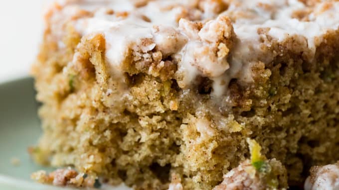piece of zucchini crumb cake on a green plate