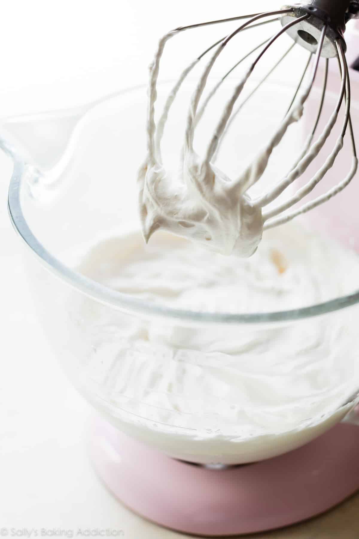 homemade whipped cream in a stand mixer bowl with whisk attachment