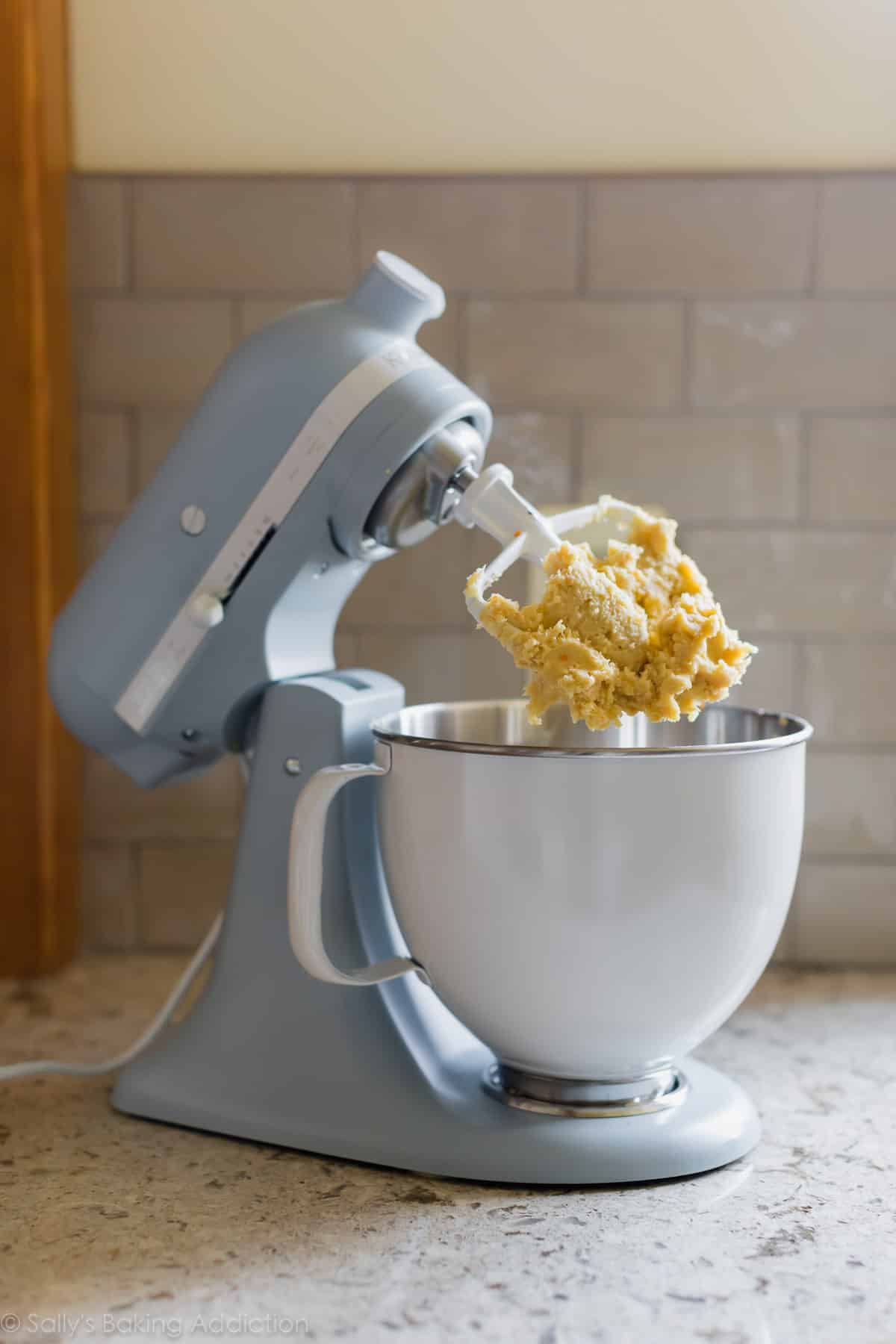 KitchenAid Misty Blue Stand Mixer with orange butter cookie dough