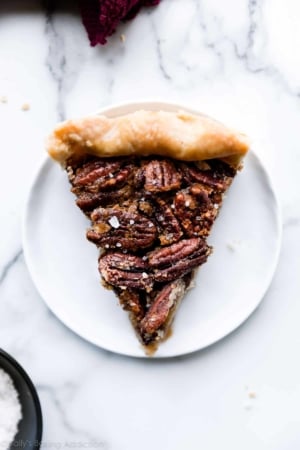slice of maple pecan pie on a white plate